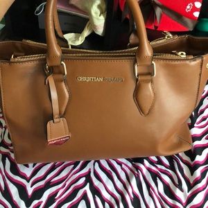 Tan Christian Siriano purse.